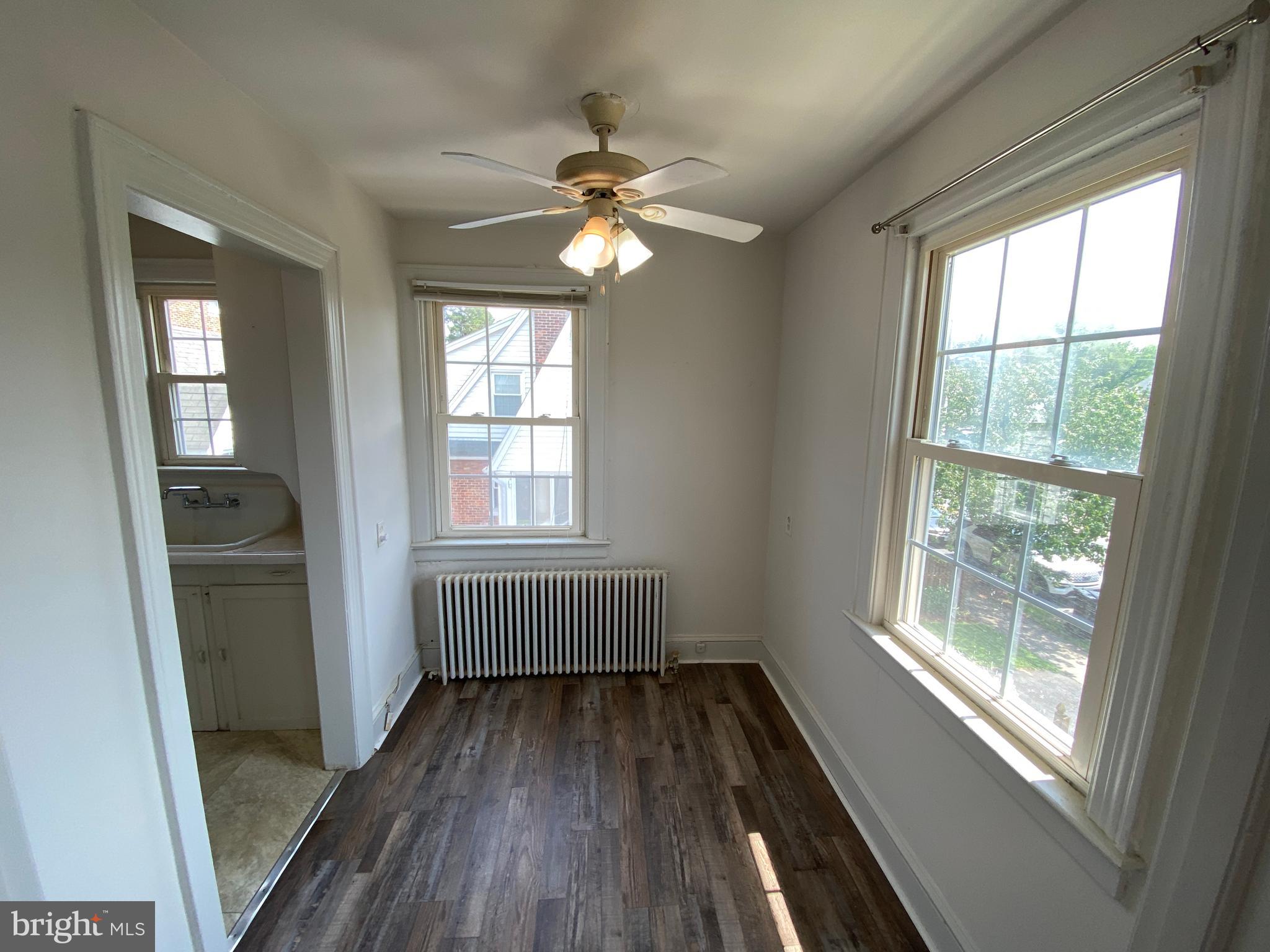 1003 Kenmore Avenue, Unit 3 Fredericksburg, VA 22401 - Photo 8 of 16 a view of empty room with wooden floor and fan