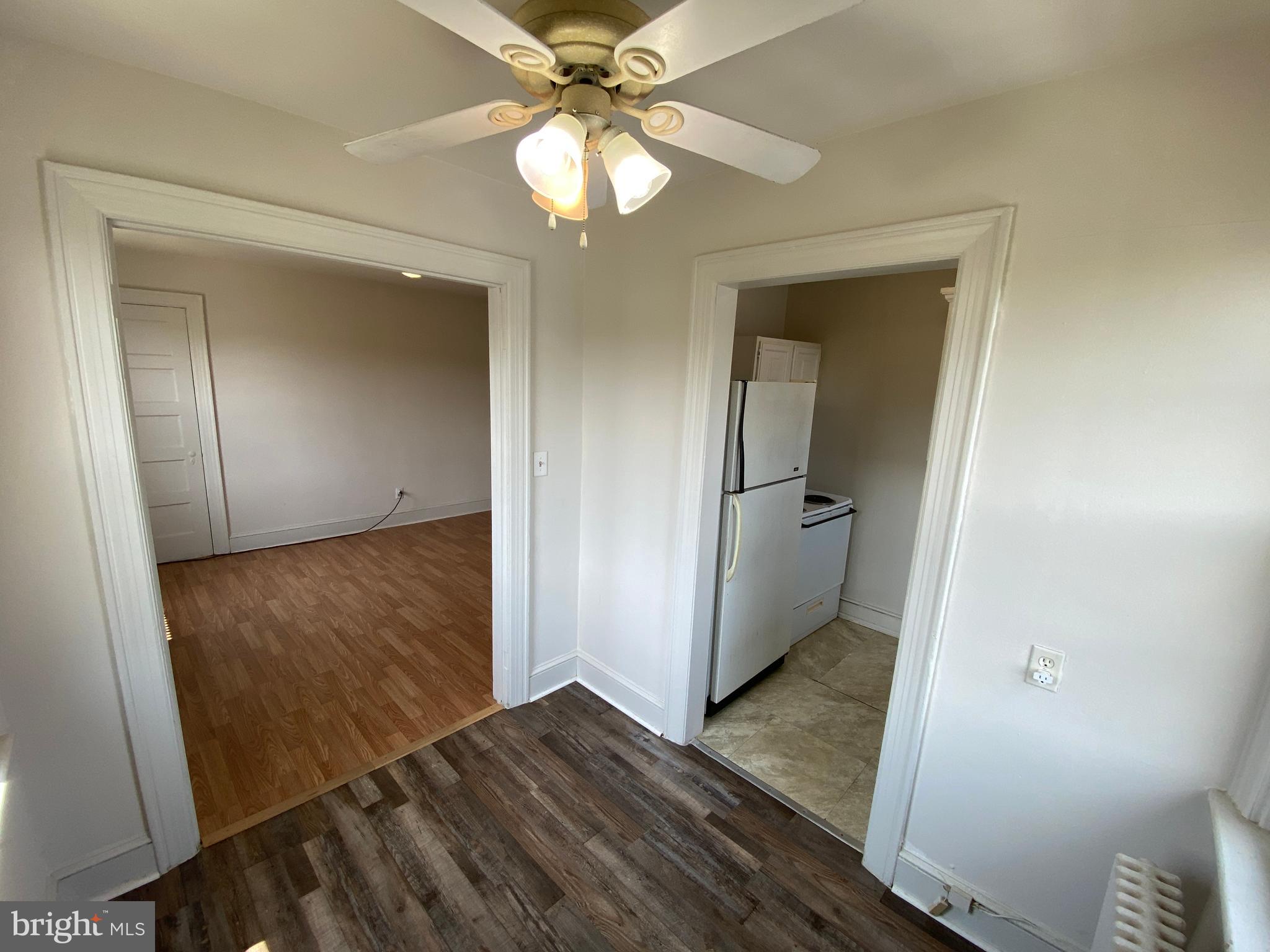 1003 Kenmore Avenue, Unit 3 Fredericksburg, VA 22401 - Photo 9 of 16 wooden floor in an empty room with a mirror