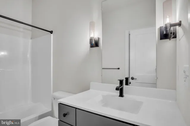 a bathroom with a sink and mirror