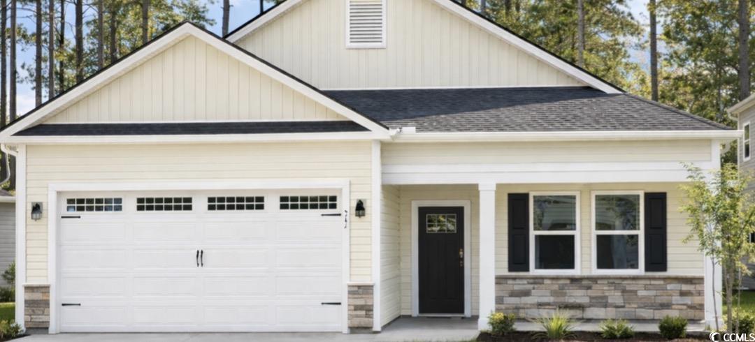 View of front facade featuring covered porch, a garage, board and batten siding, a shingled roof, and concrete driveway