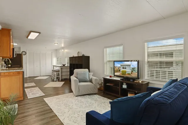 a living room with furniture or couch and a flat screen tv