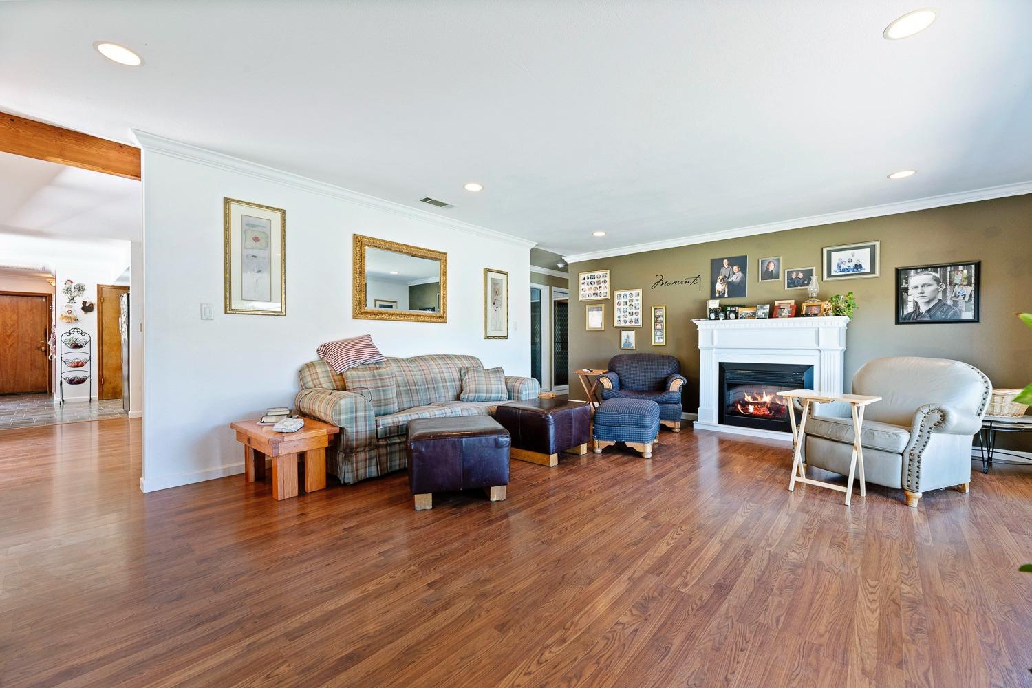 305 Monroe Street Coalinga, CA 93210 - Photo 12 of 53 a living room with furniture and a fireplace