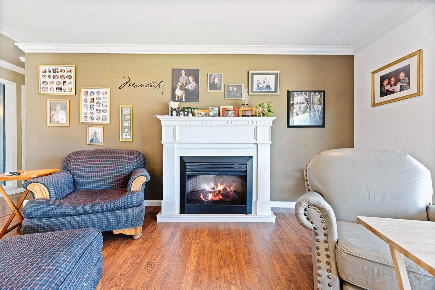 305 Monroe Street Coalinga, CA 93210 - Photo 13 of 53 a living room with furniture and a fireplace