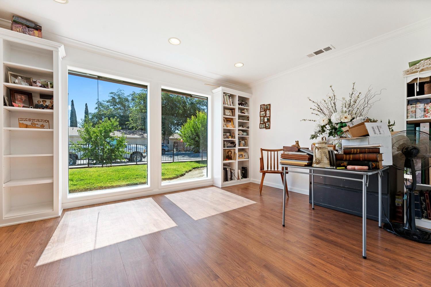 305 Monroe Street Coalinga, CA 93210 - Photo 16 of 53 a living room with furniture and a floor to ceiling window