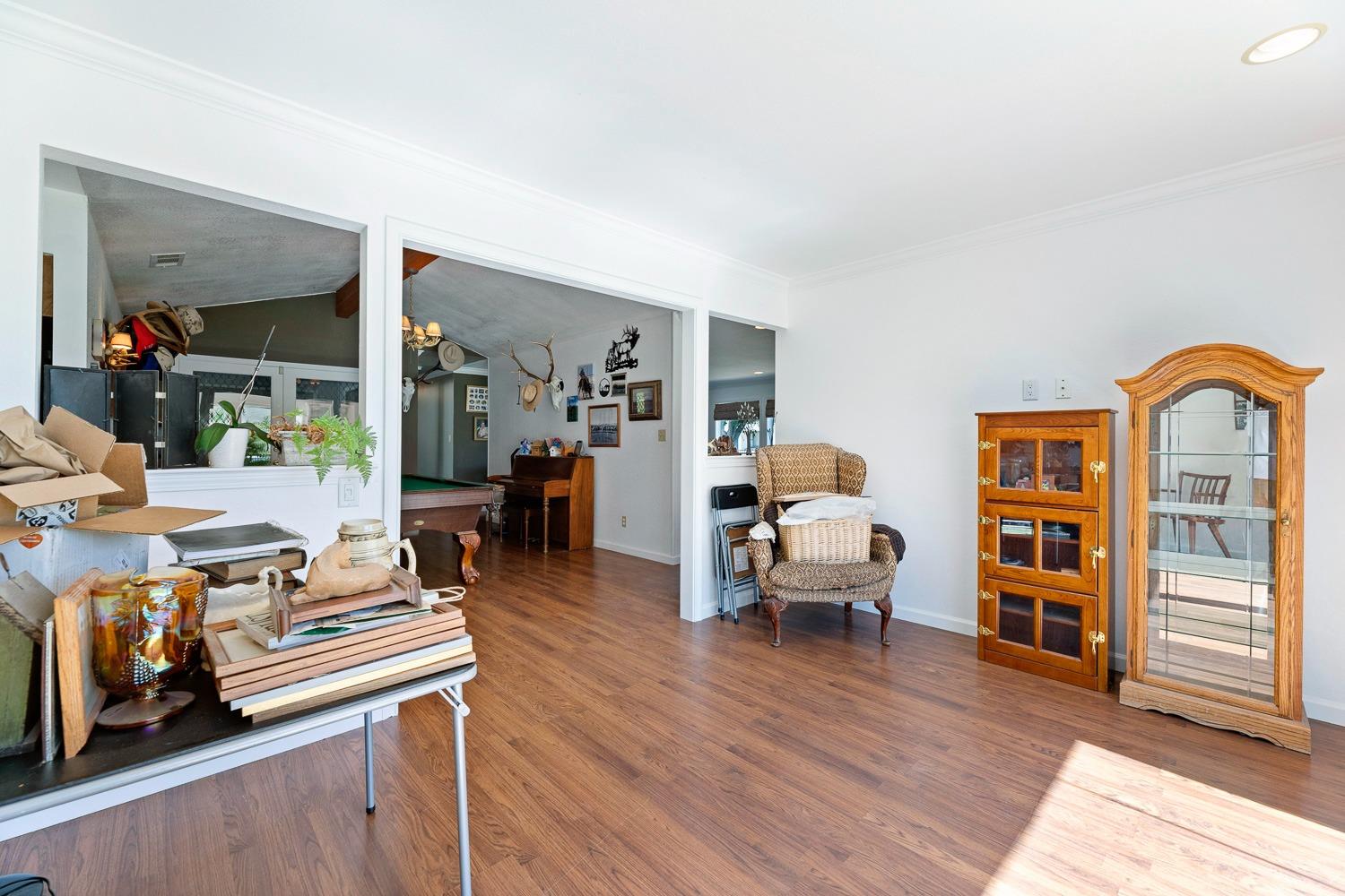 305 Monroe Street Coalinga, CA 93210 - Photo 17 of 53 a living room with furniture and a wooden floor