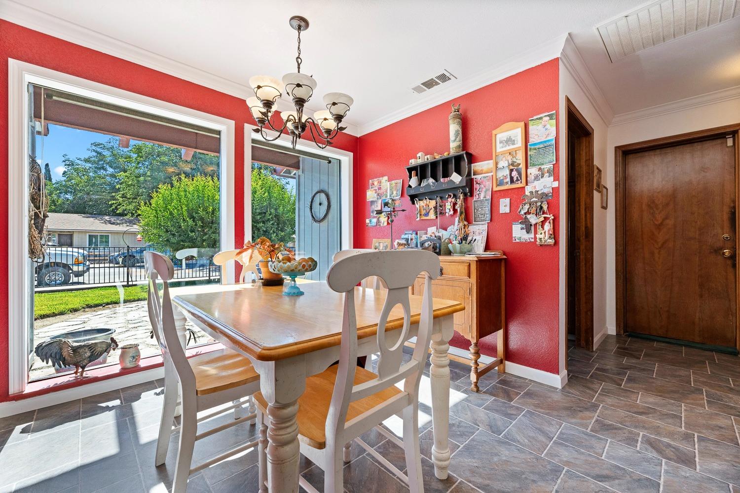 305 Monroe Street Coalinga, CA 93210 - Photo 19 of 53 a dining room with furniture a chandelier and window