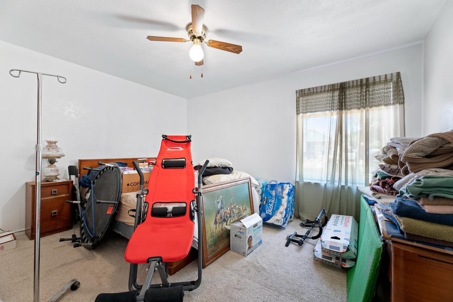 305 Monroe Street Coalinga, CA 93210 - Photo 31 of 53 a room with furniture and a window