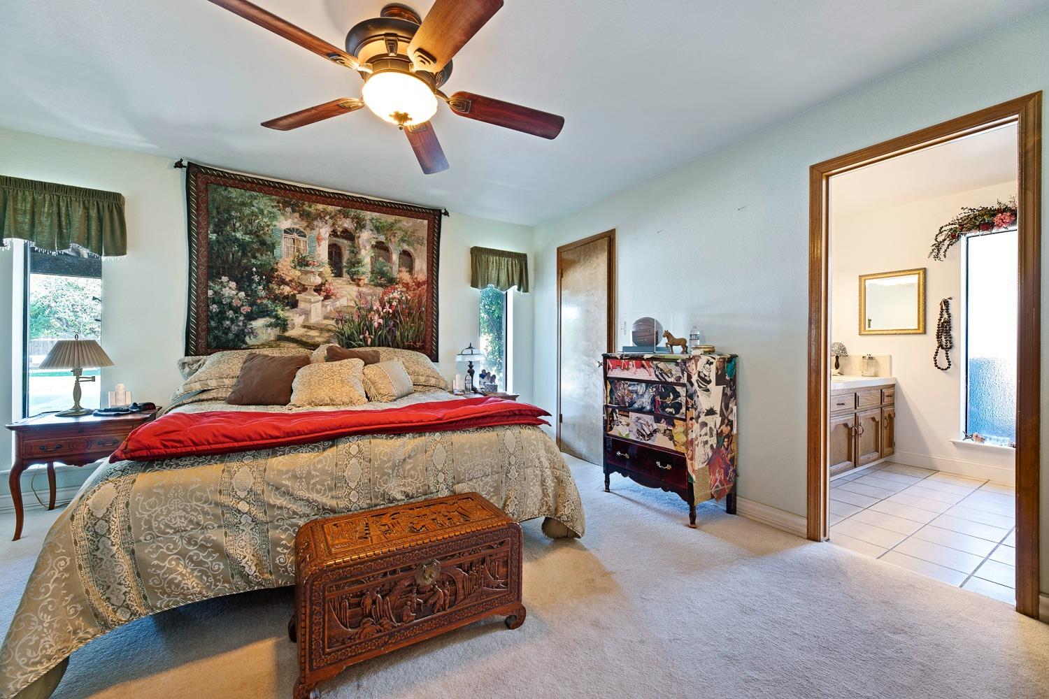 305 Monroe Street Coalinga, CA 93210 - Photo 32 of 53 a bedroom with a bed and a chandelier