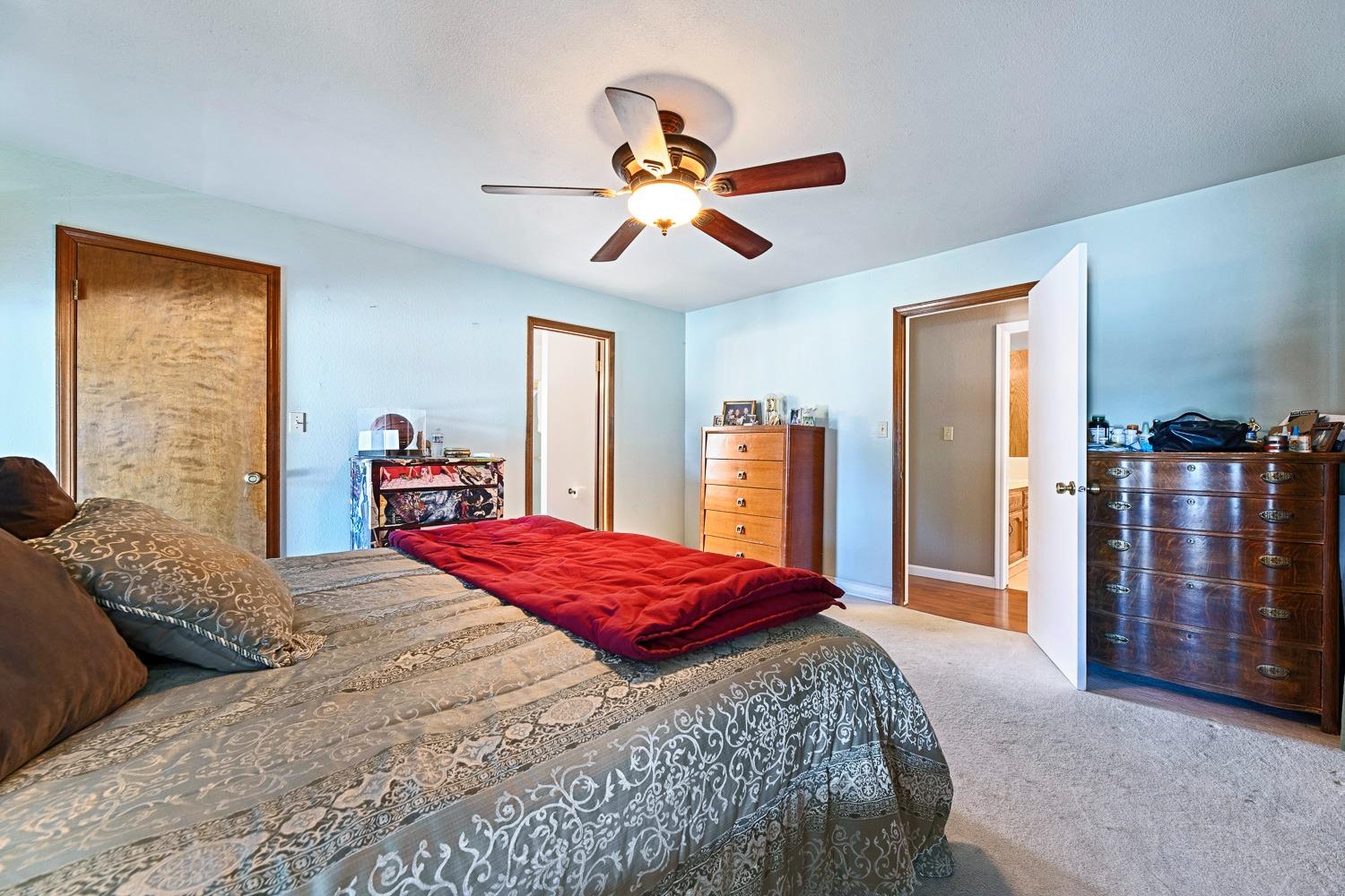 305 Monroe Street Coalinga, CA 93210 - Photo 33 of 53 a bedroom with a bed and wooden floor