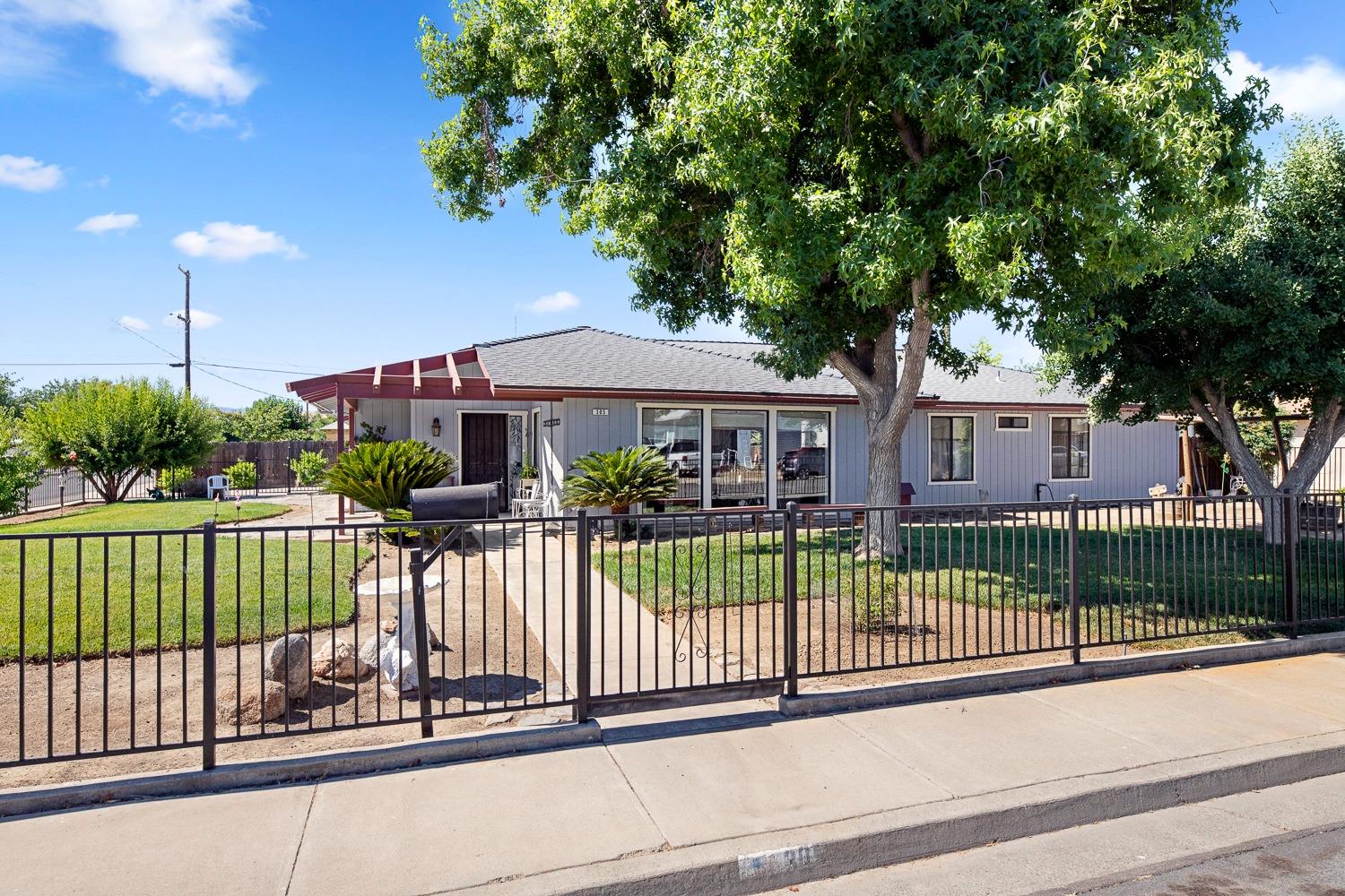 305 Monroe Street Coalinga, CA 93210 - Photo 4 of 53 a view of a house with a balcony