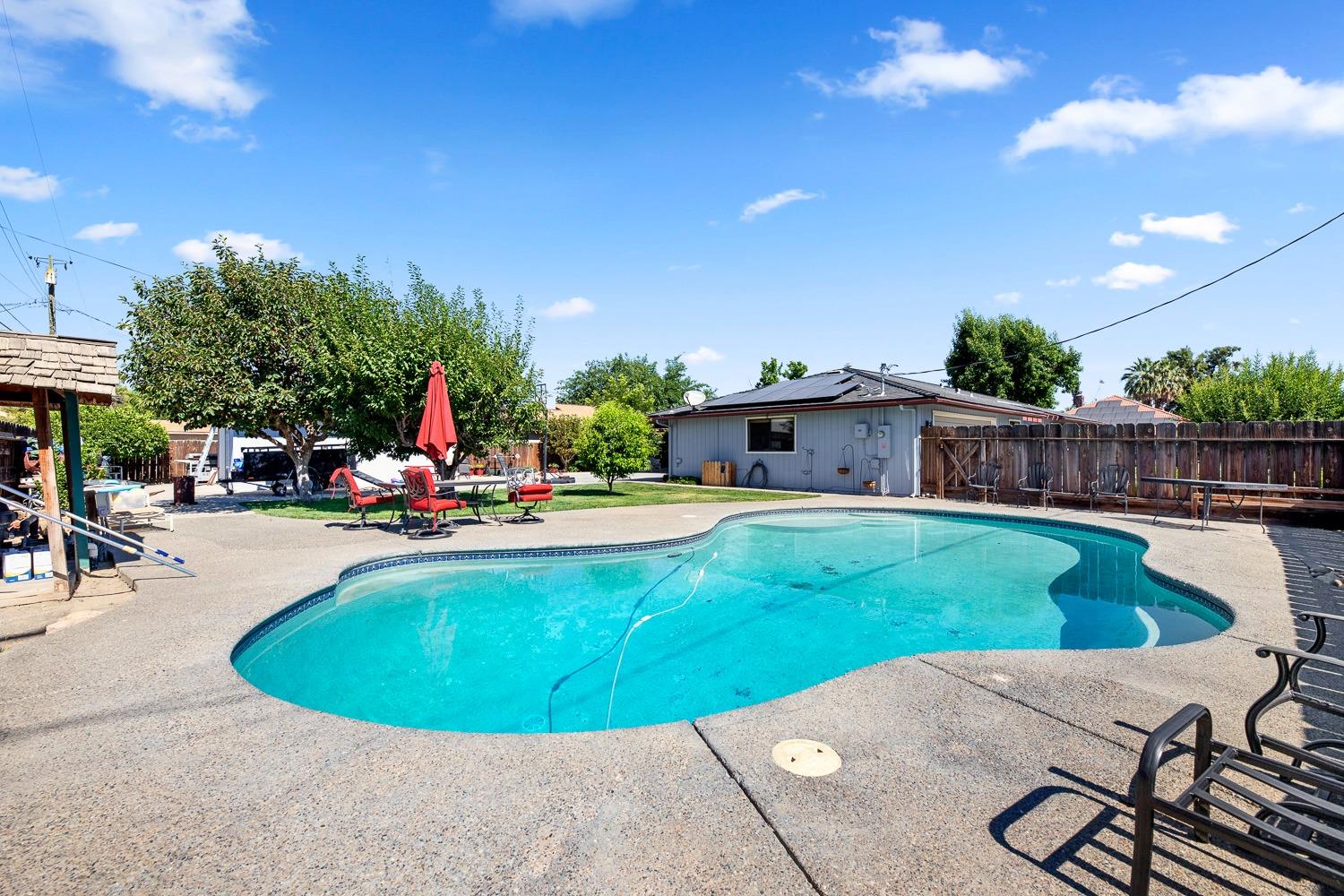 305 Monroe Street Coalinga, CA 93210 - Photo 41 of 53 a view of a swimming pool with a patio