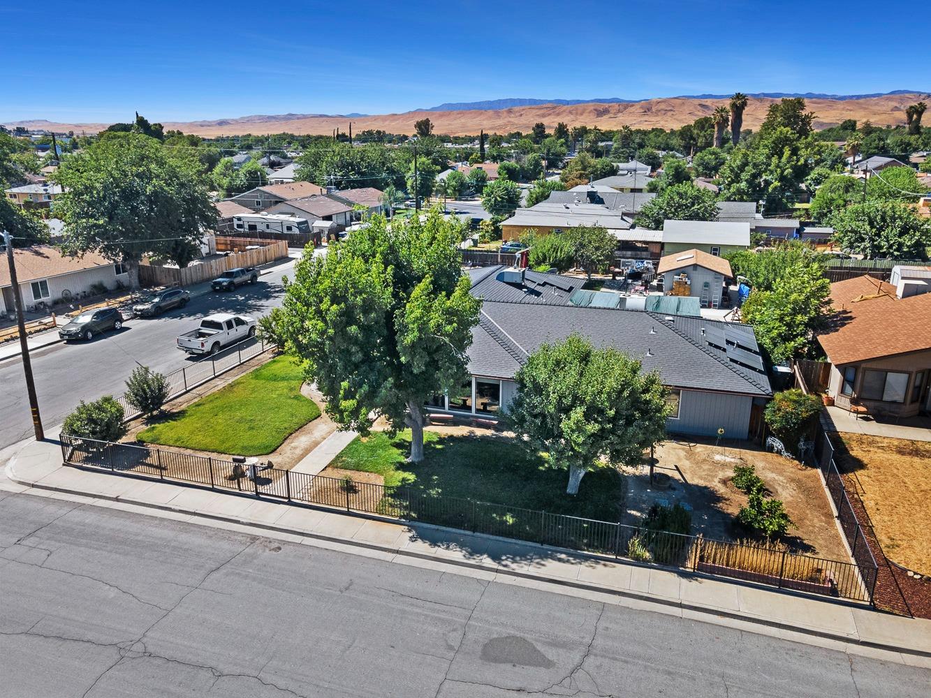 305 Monroe Street Coalinga, CA 93210 - Photo 45 of 53 an aerial view of a houses with a street