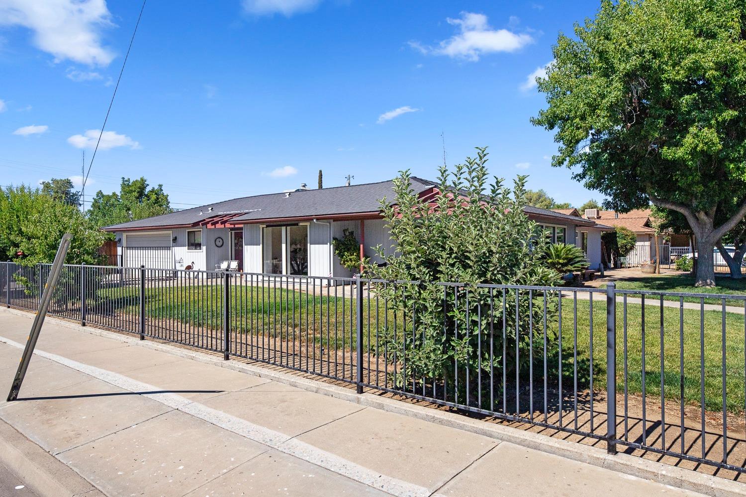 305 Monroe Street Coalinga, CA 93210 - Photo 5 of 53 a house view with a garden space
