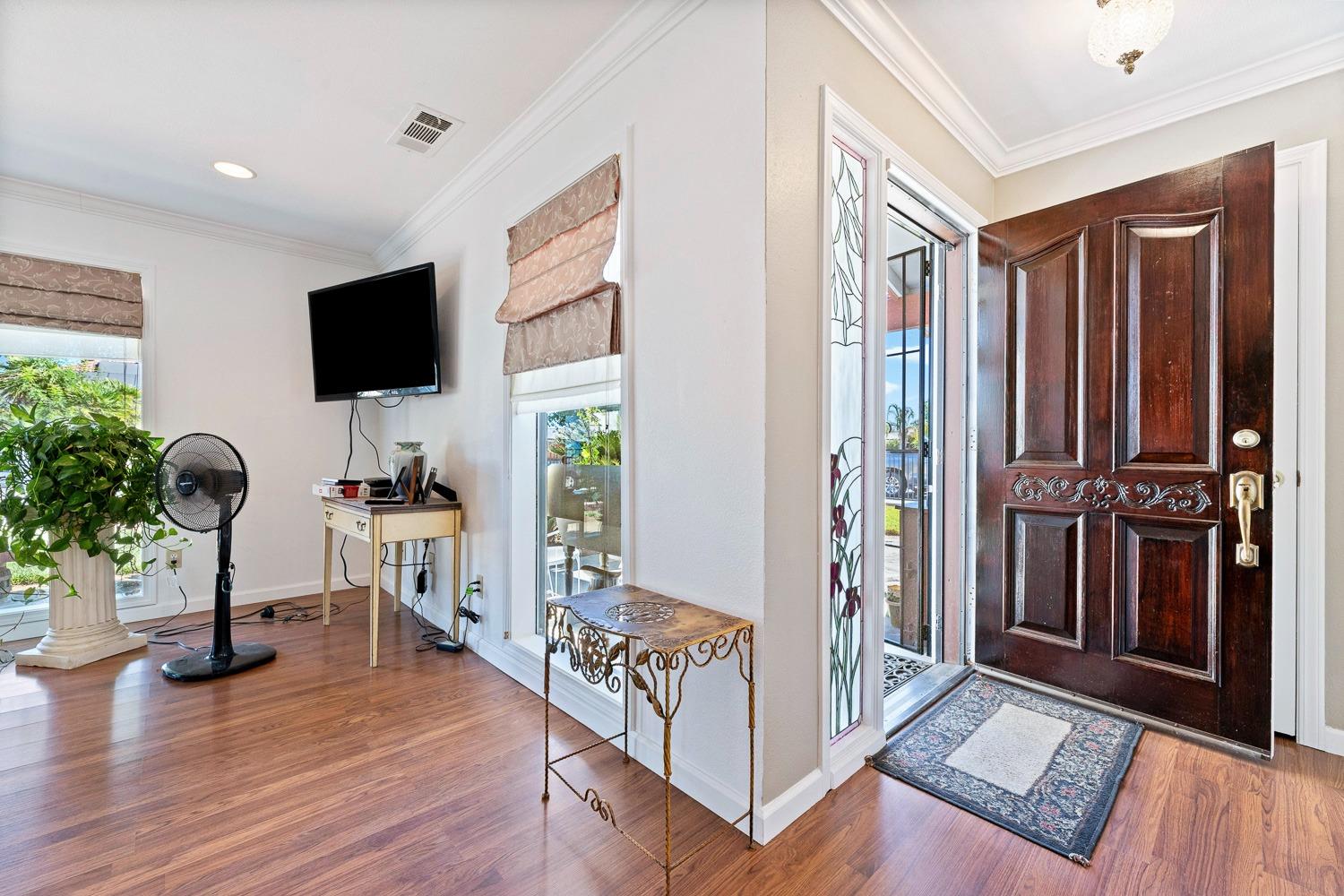 305 Monroe Street Coalinga, CA 93210 - Photo 9 of 53 a living room with furniture and a flat screen tv