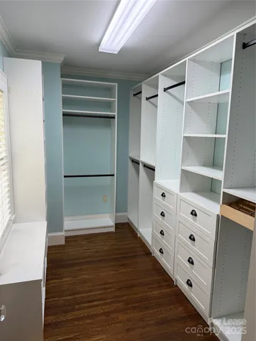 a view of an empty walk in closet