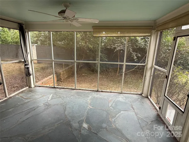 a view of an empty room with a sliding door