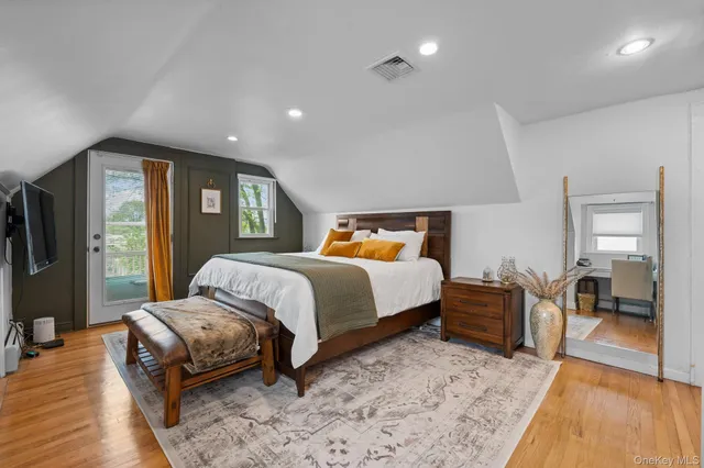 a bedroom with a large bed and a couch