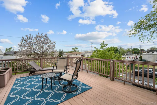 a view of a balcony with furniture