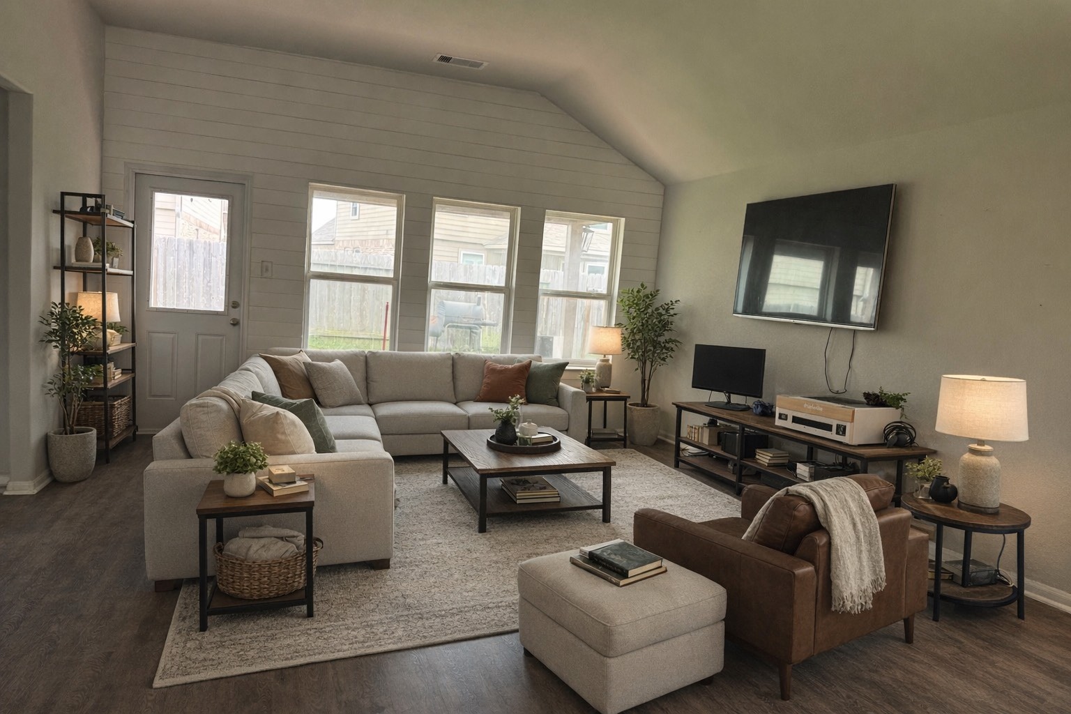 3323 Winchester Rnch Trail Katy, TX 77493 - Photo 2 of 22 Stunning open-concept living area designed for comfort and style! This bright and airy space features high ceilings and a wall of windows that flood the room with natural light, creating a warm and inviting atmosphere.