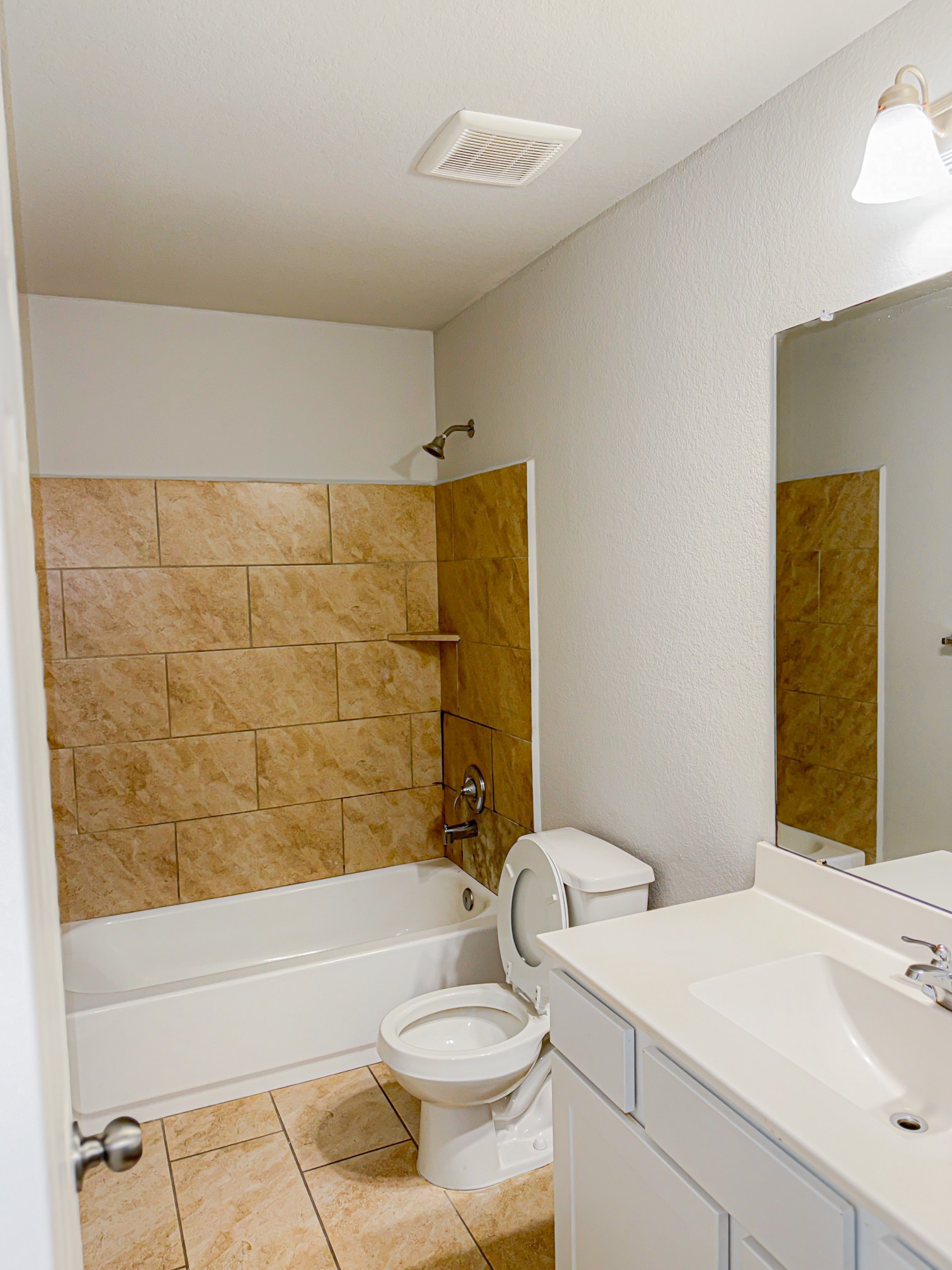 3323 Winchester Rnch Trail Katy, TX 77493 - Photo 8 of 22 This bathroom features a glass-enclosed shower with sleek sliding doors and elegant tile surround for a clean, modern look.