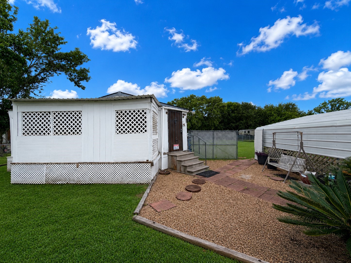 153 Prairie Lea Drive Angleton, TX 77515 - Photo 3 of 30 a view of a backyard with sitting area