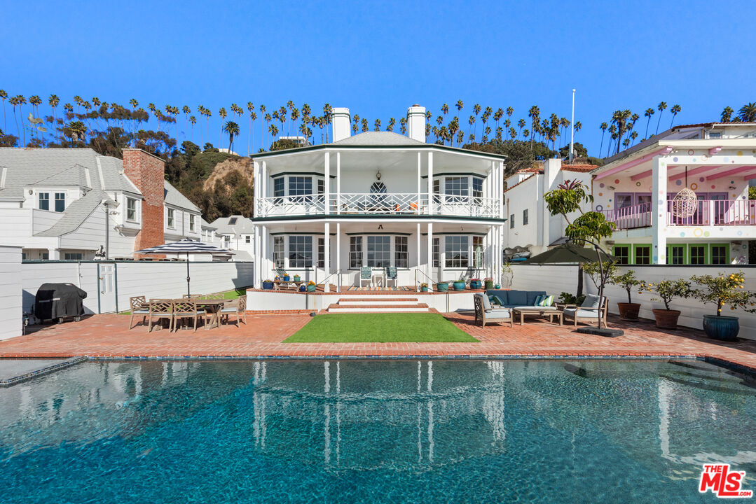 605 Palisades Beach Road Santa Monica, CA 90402 - Photo 2 of 33 a view of a house with swimming pool yard and sitting area