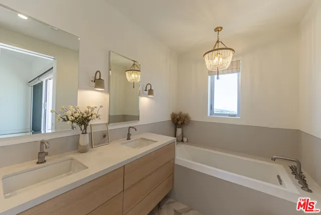 a bathroom with a bathtub and a sink
