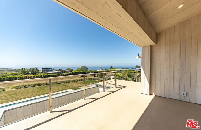 a view of a balcony with ocean view