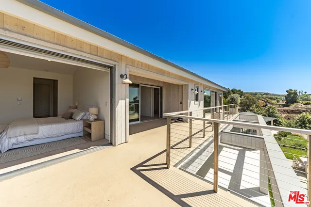 a view of a swimming pool with a lounge chair