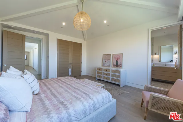 a bedroom with a bed and furniture