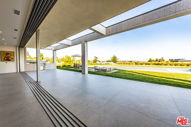 a view of an ocean and trees