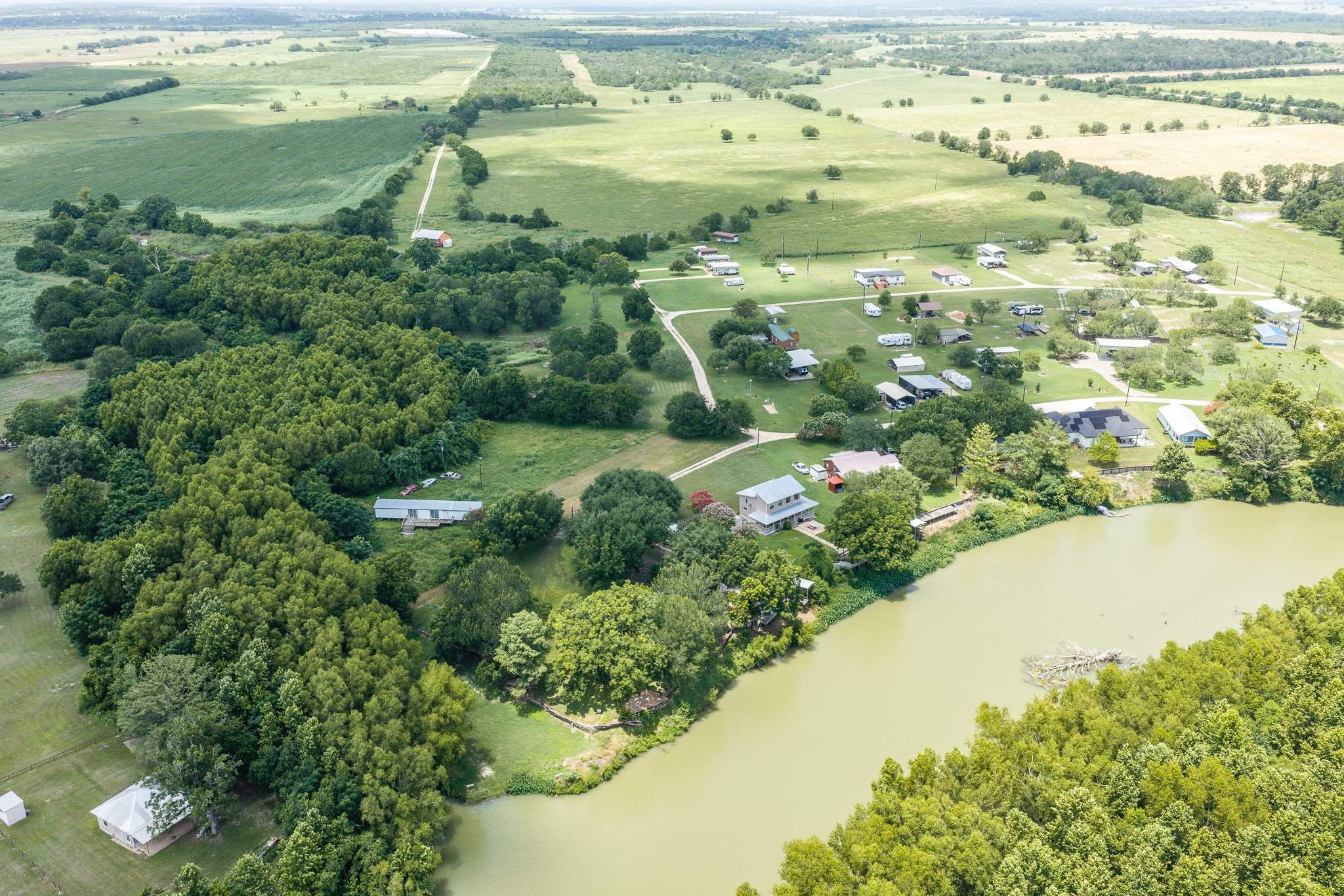 Tbd Goodwin Road Gonzales, TX 78629 - Photo 32 of 33 A winding river courses through a verdant landscape, surrounded by abundant natural beauty.