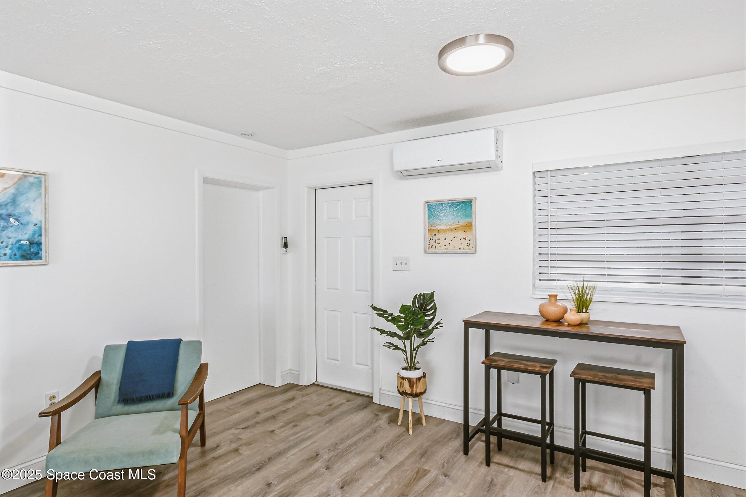 300 South Orlando Avenue, Unit 4 5 6 Cocoa Beach, FL 32931 - Photo 22 of 56 a workspace with furniture and wooden floor