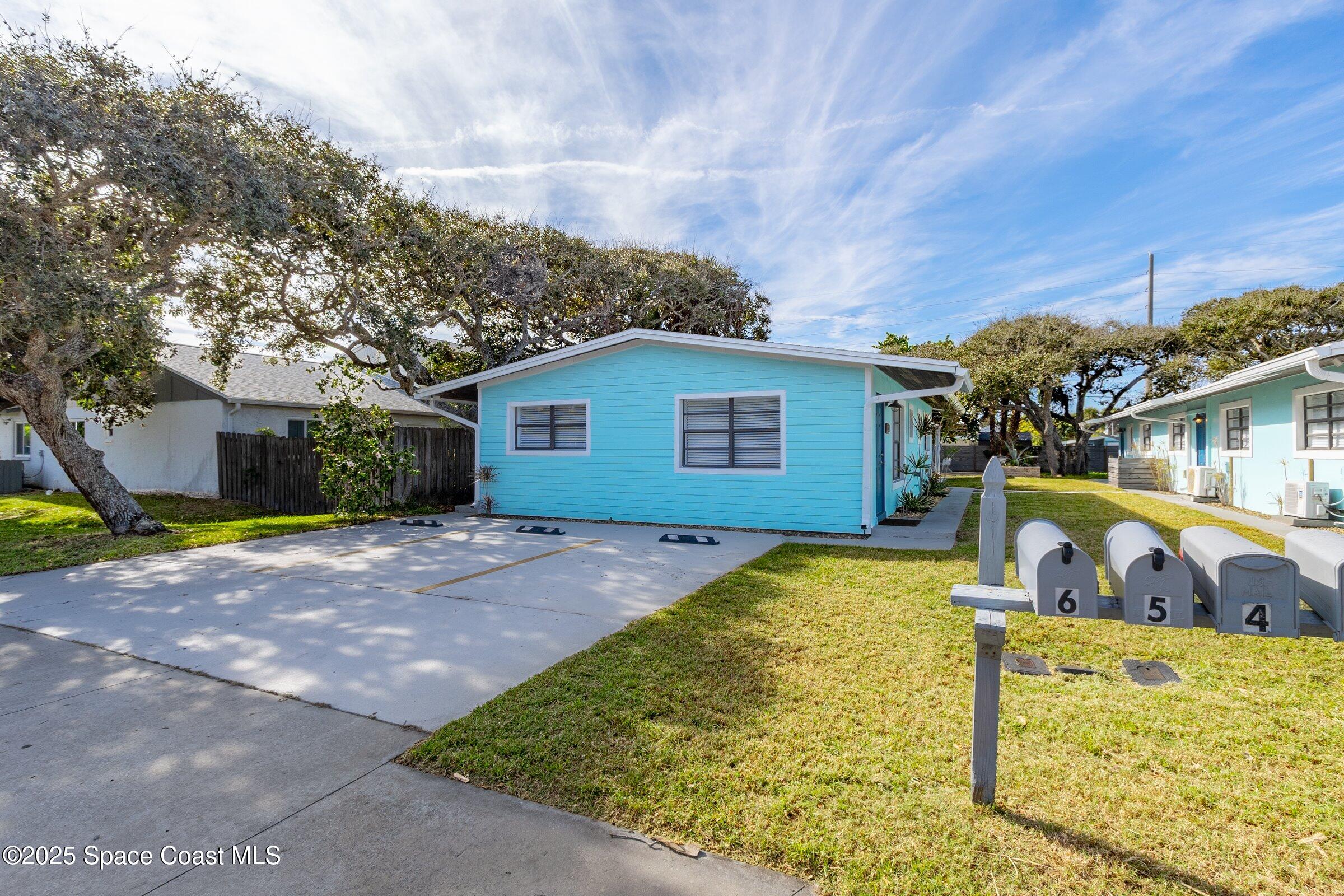 300 South Orlando Avenue, Unit 4 5 6 Cocoa Beach, FL 32931 - Photo 3 of 56 a view of a house with outdoor space