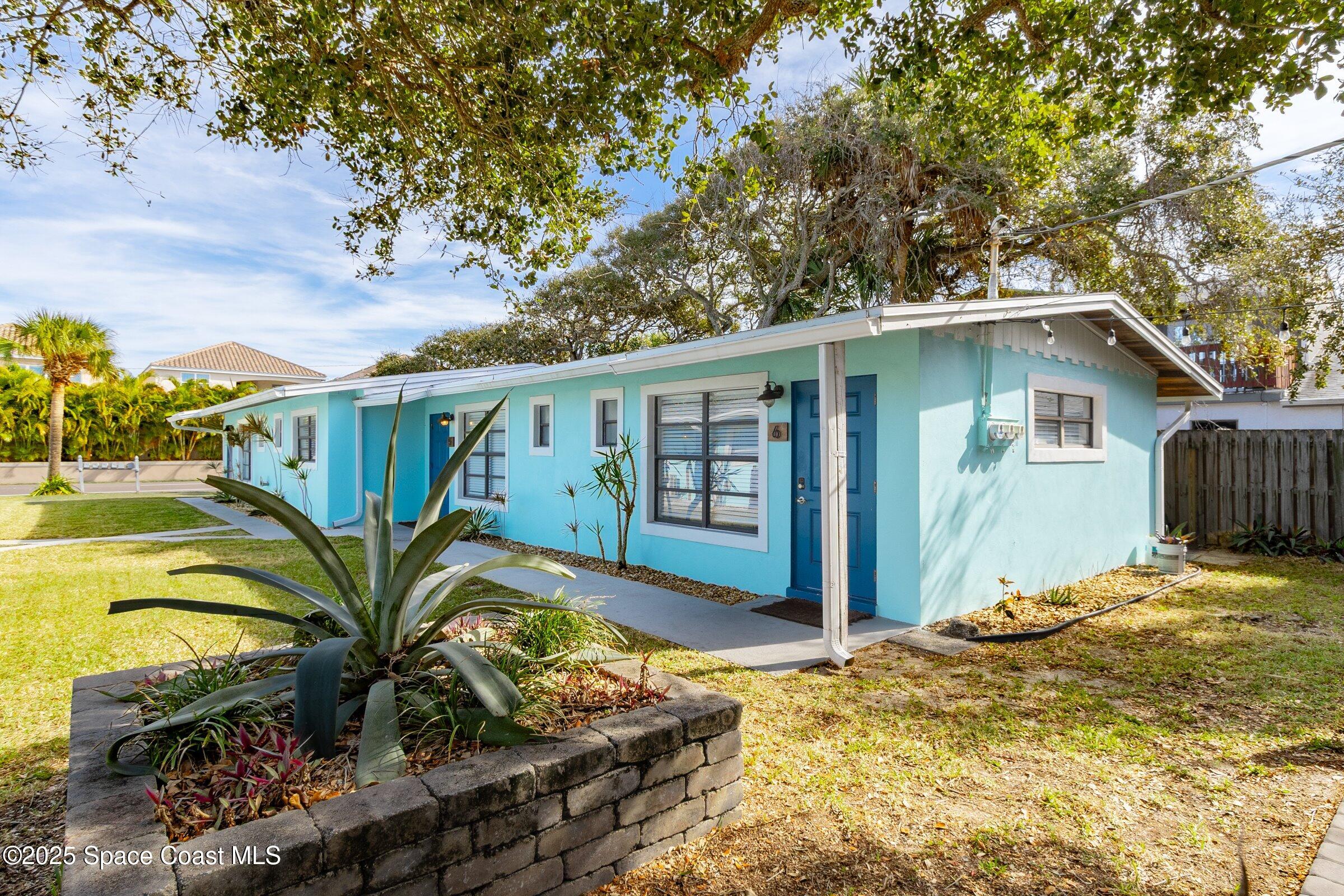 300 South Orlando Avenue, Unit 4 5 6 Cocoa Beach, FL 32931 - Photo 33 of 56 a view of a backyard with plants