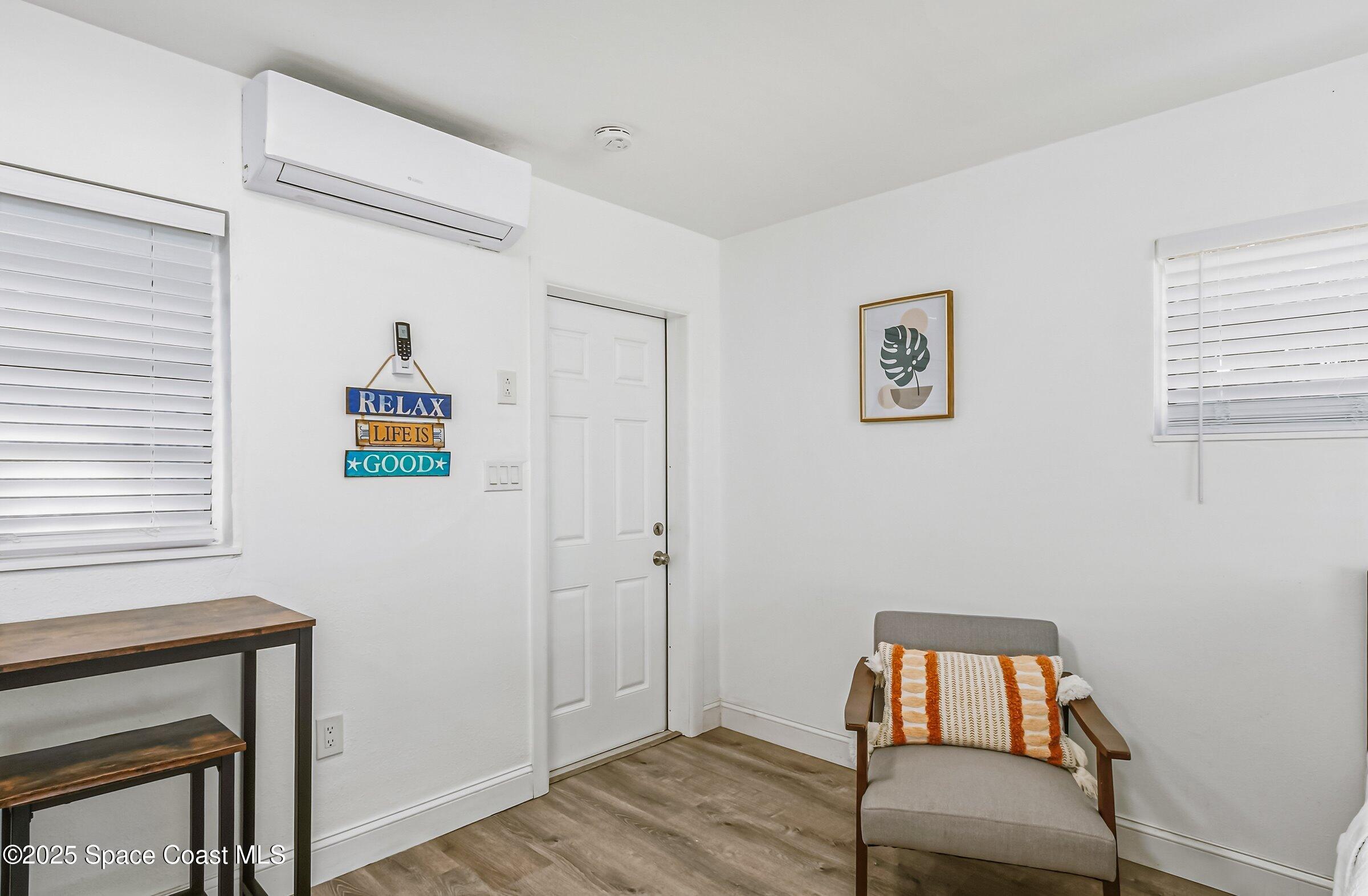 300 South Orlando Avenue, Unit 4 5 6 Cocoa Beach, FL 32931 - Photo 36 of 56 a room with chair and a window