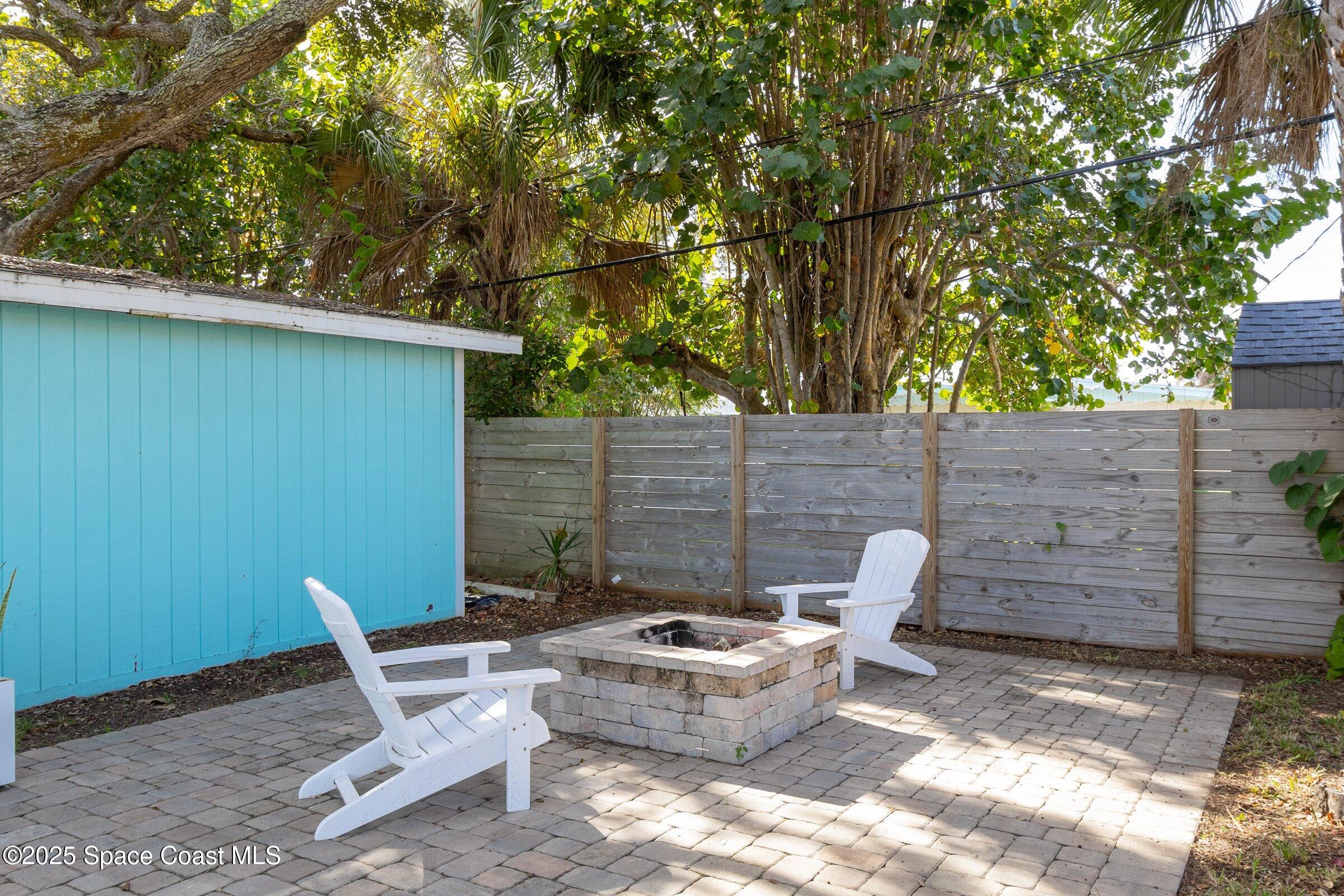 300 South Orlando Avenue, Unit 4 5 6 Cocoa Beach, FL 32931 - Photo 44 of 56 a view of outdoor sitting area with furniture and wooden fence