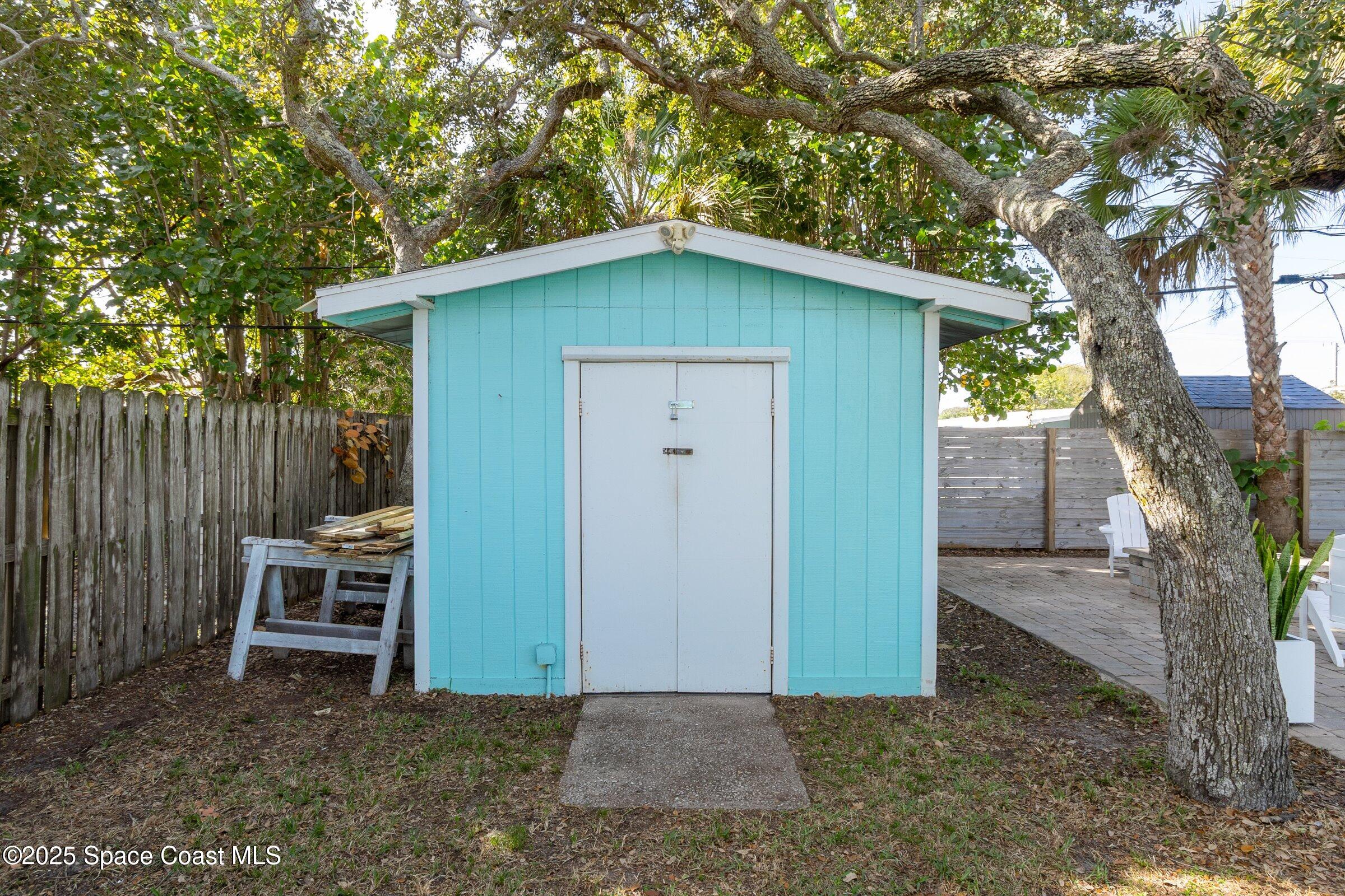 300 South Orlando Avenue, Unit 4 5 6 Cocoa Beach, FL 32931 - Photo 45 of 56 a view of a house with a yard