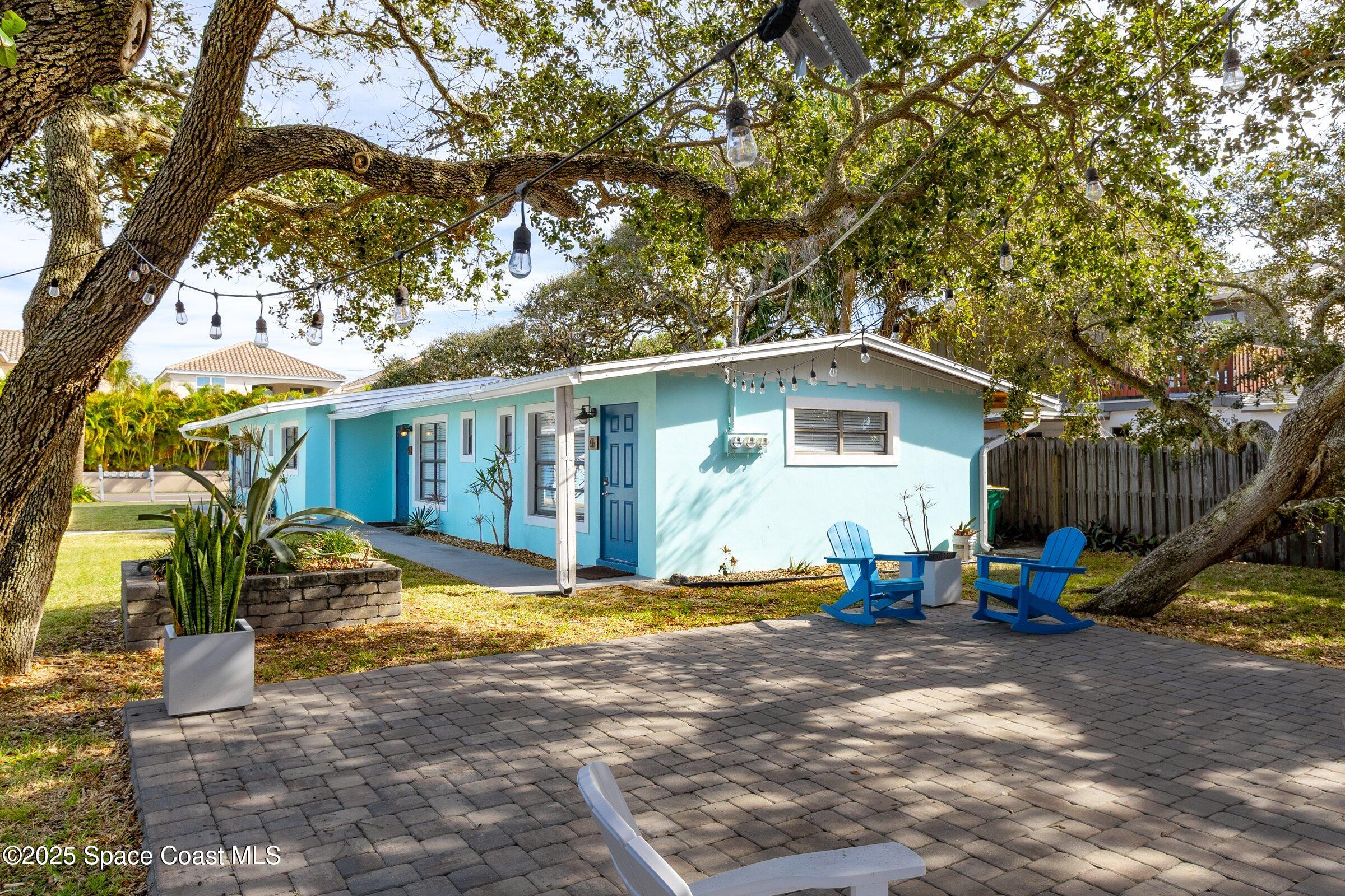 300 South Orlando Avenue, Unit 4 5 6 Cocoa Beach, FL 32931 - Photo 47 of 56 a view of a house with backyard and sitting area