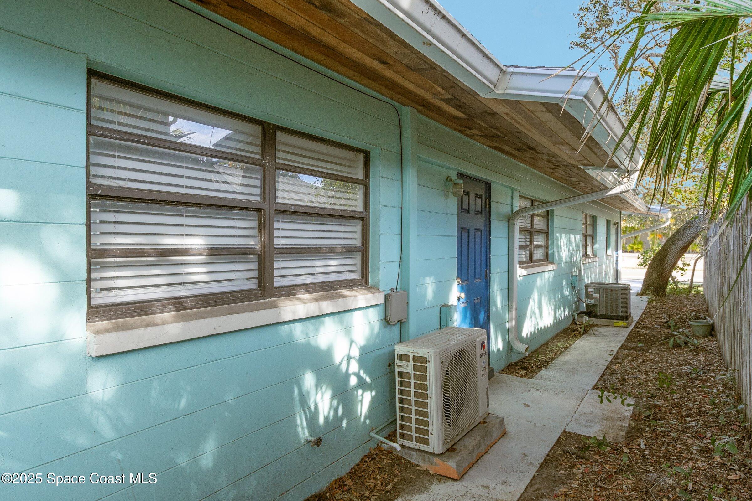 300 South Orlando Avenue, Unit 4 5 6 Cocoa Beach, FL 32931 - Photo 48 of 56 a view of a house with a large window
