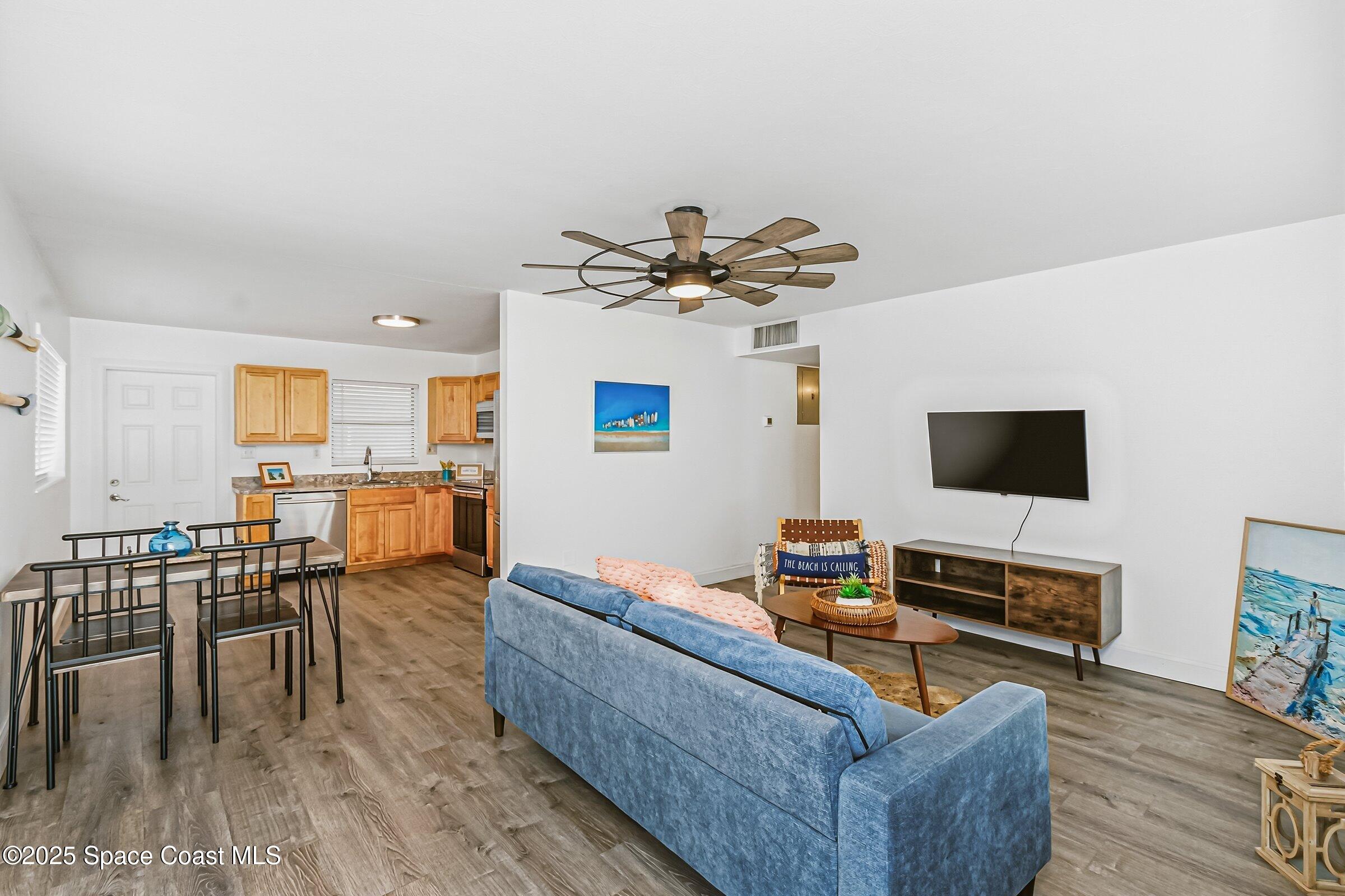 300 South Orlando Avenue, Unit 4 5 6 Cocoa Beach, FL 32931 - Photo 5 of 56 a living room with furniture and a flat screen tv
