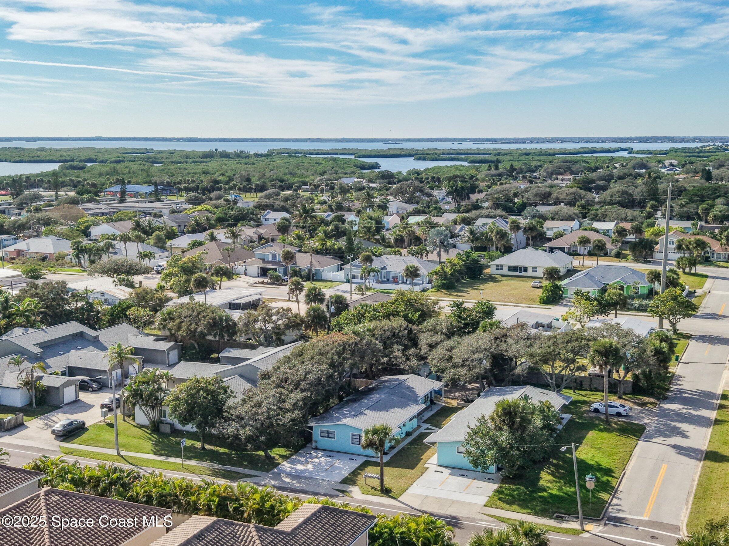 300 South Orlando Avenue, Unit 4 5 6 Cocoa Beach, FL 32931 - Photo 54 of 56 an aerial view of residential houses with outdoor space