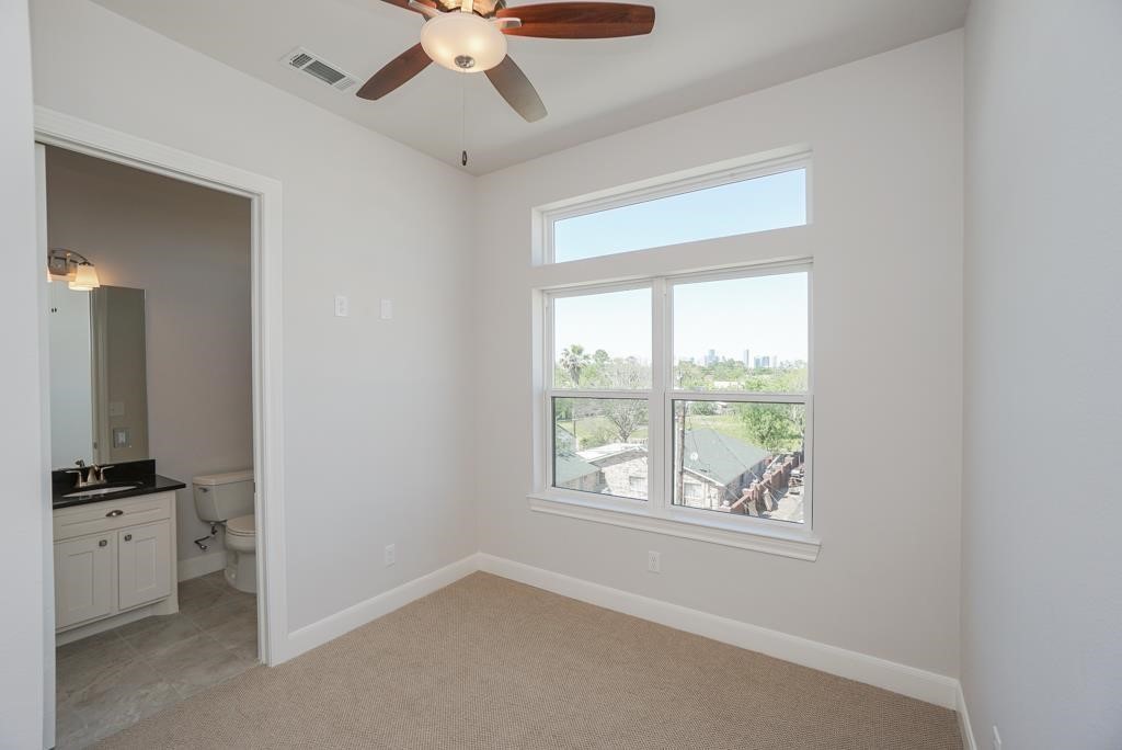 3351 Kilgore Street Houston, TX 77021 - Photo 11 of 25 an empty room with a window and a ceiling fan