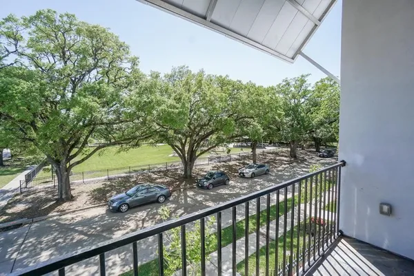 a view of a yard from a balcony
