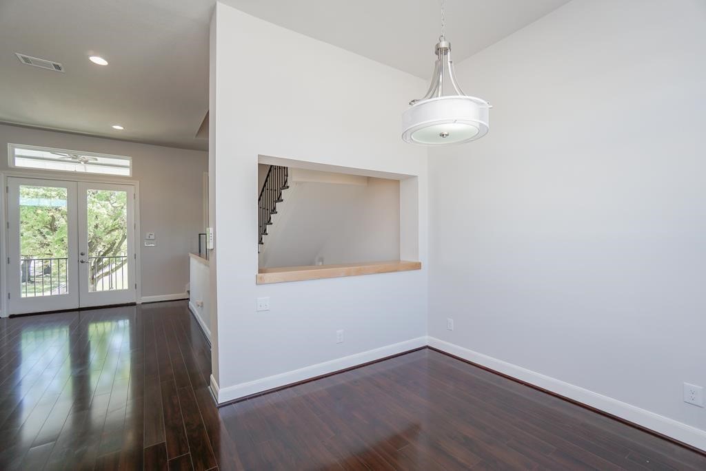 3351 Kilgore Street Houston, TX 77021 - Photo 22 of 25 a view of an empty room with wooden floor and a window