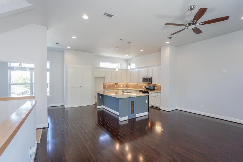 3351 Kilgore Street Houston, TX 77021 - Photo 3 of 25 a room with wooden floors and ceiling fan