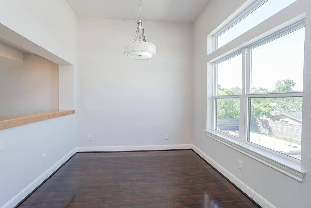 3351 Kilgore Street Houston, TX 77021 - Photo 8 of 25 an empty room with wooden floor and windows