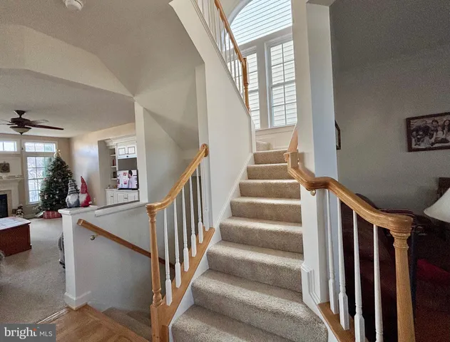 a view of a room with wooden floor and furniture