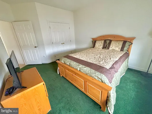 a spacious bathroom with a double vanity sink and a mirror