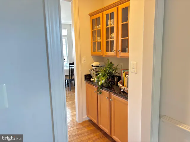 a view of a livingroom with workspace and a window